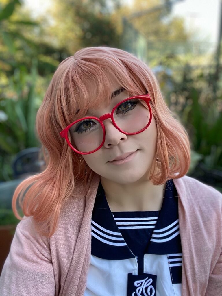 peach pink wig and red glasses